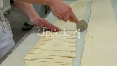 german bakery cuts special pieces of dough 10771