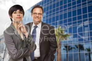 Mixed Race Woman and Businessman in Front of Building