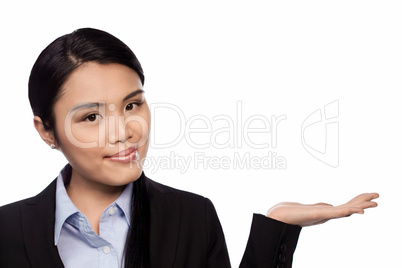 Asian businesswoman holding out her palm