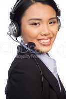 Smiling Asian call centre telephonist