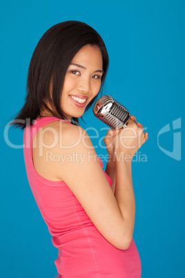 Pretty Young Asian woman with a microphone