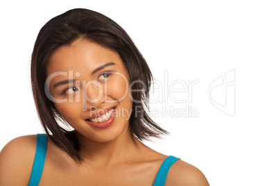 Smiling Asian woman looking up