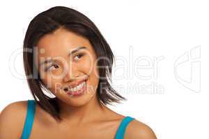 Smiling Asian woman looking up