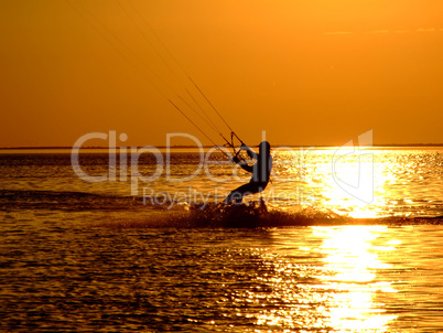 Silhouette of a kitesurf on a gulf on a sunset 2