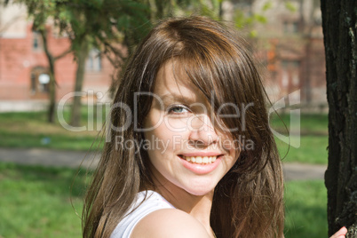 Portrait of the smiling beauty girl outdoor