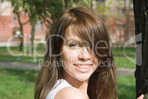 Portrait of the smiling beauty girl outdoor