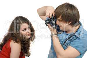 Photographer taking pictures of the young woman. isolated