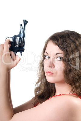 Young woman with a pistol. Isolated on white