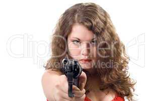 Young woman with a pistol. Isolated on white