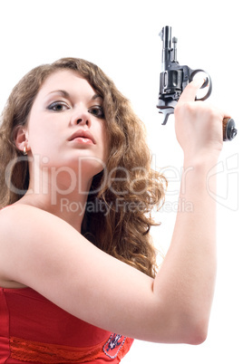 Young woman with a revolver. Isolated on white