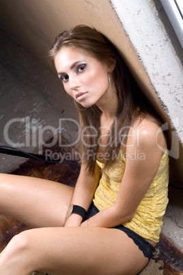 the sexy young beauty woman sitting near wall 2