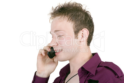 portrait of the young man, speaking by phone. Isolated