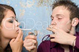 young couple with a cigarettes and a lighter 2