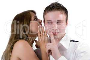 The young woman whispers on an ear to the young man