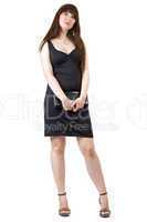 The young woman with a handbag in a black dress. Isolated