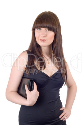 Portrait of the young woman with a handbag in a black dress. Iso