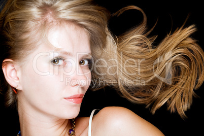 Portrait of the beauty blonde. Isolated on black background