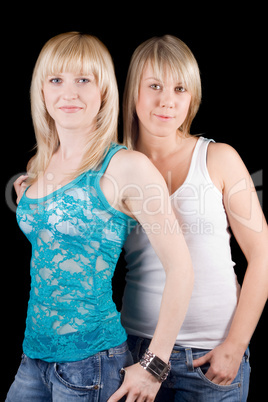 Portrait of the two young beauty blonde. Isolated