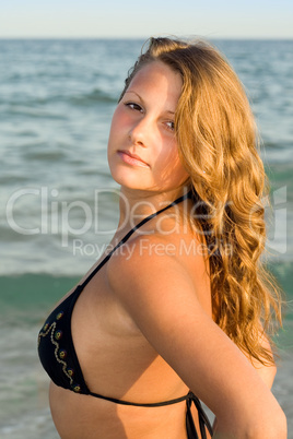 Portrait of the young woman against the sea