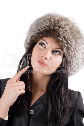 Portrait of the young woman in a fur cap. Isolated on white back