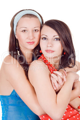 Two embracing beauty young women. Isolated on a white