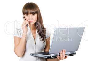 Businesswoman with laptop speaks on the phone