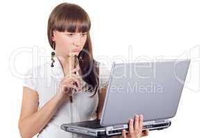 Young businesswoman with phone and laptop over white