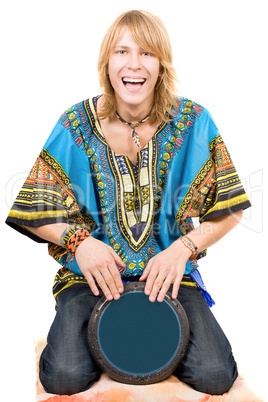 The young man plays a drum over white