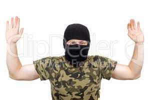 The surrendered criminal in a black mask over white
