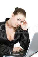 Young businesswoman works on the laptop over white