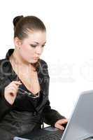 Young businesswoman works on the laptop. Isolated