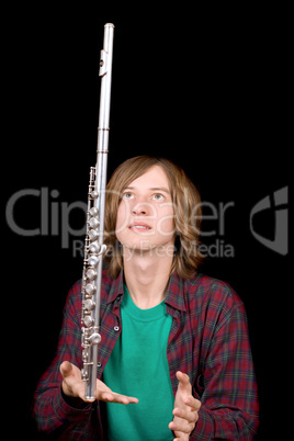 The young man plays with a flute