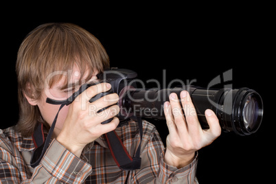 Photographer with the camera with a zoom lens