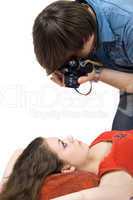 Photographer taking pictures of the young woman