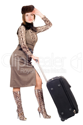 Young lady with a suitcase. Isolated on white