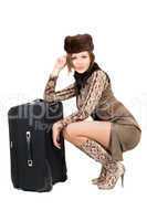 Young beautiful woman with a suitcase. Isolated