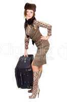 Young beautiful woman with a heavy suitcase. Isolated