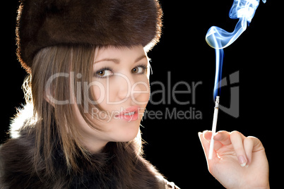 Portrait of the beautiful woman with a cigarette