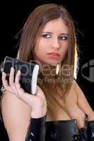Beautiful young woman with a flask over black