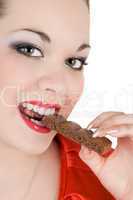 Portrait of the young woman eating chocolate