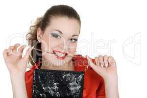 Young beautiful woman with a handbag in a teeth