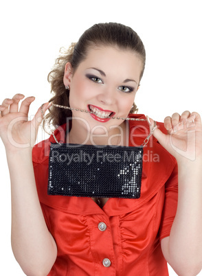 Young woman with a handbag in a teeth