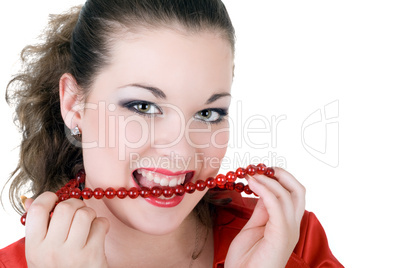 Young beautiful woman with a beads in a teeth