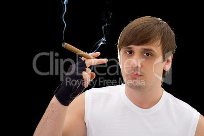 Portrait of the young man with cigar. Isolated