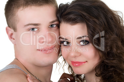 Portrait of the young beautiful couple. Isolated on white