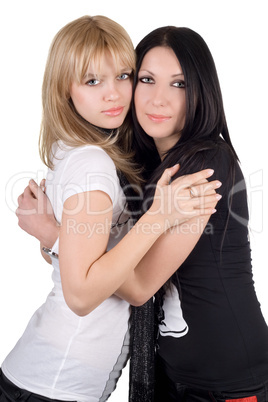 Portrait of the two embracing girlfriends. Isolated on white