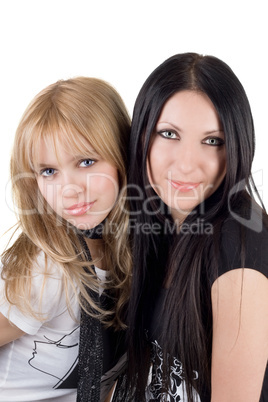 Portrait of the two pretty smiling girlfriends. Isolated