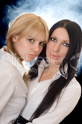 Portrait of the young pretty brunette and blonde