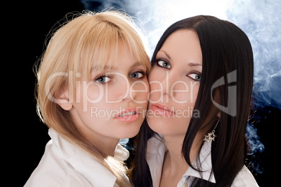Portrait of the beautiful young blonde and brunette