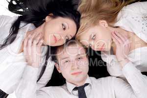 Portrait if the young man and two pretty women